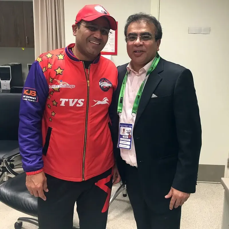 Dr. Ashfaq Konchwalla with athlete, pitch-side