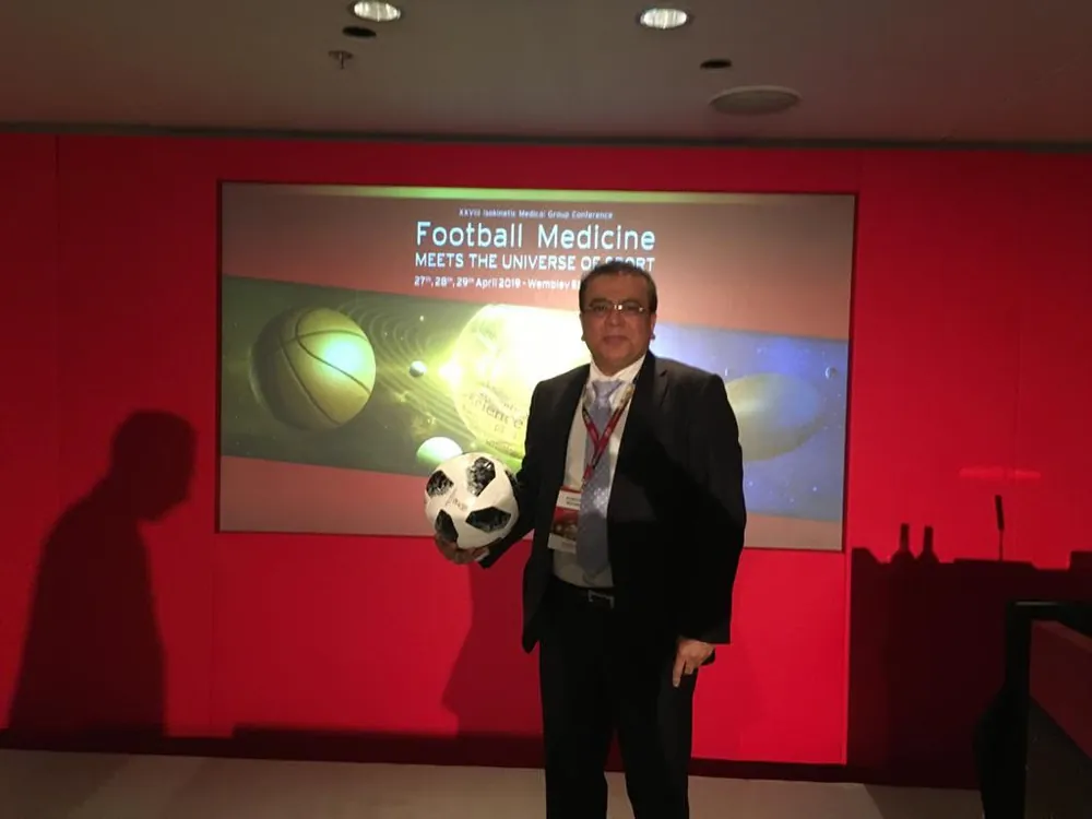 Football FIFA Sports Surgery Experience — Dr. Konchwalla at a Football Medicine conference